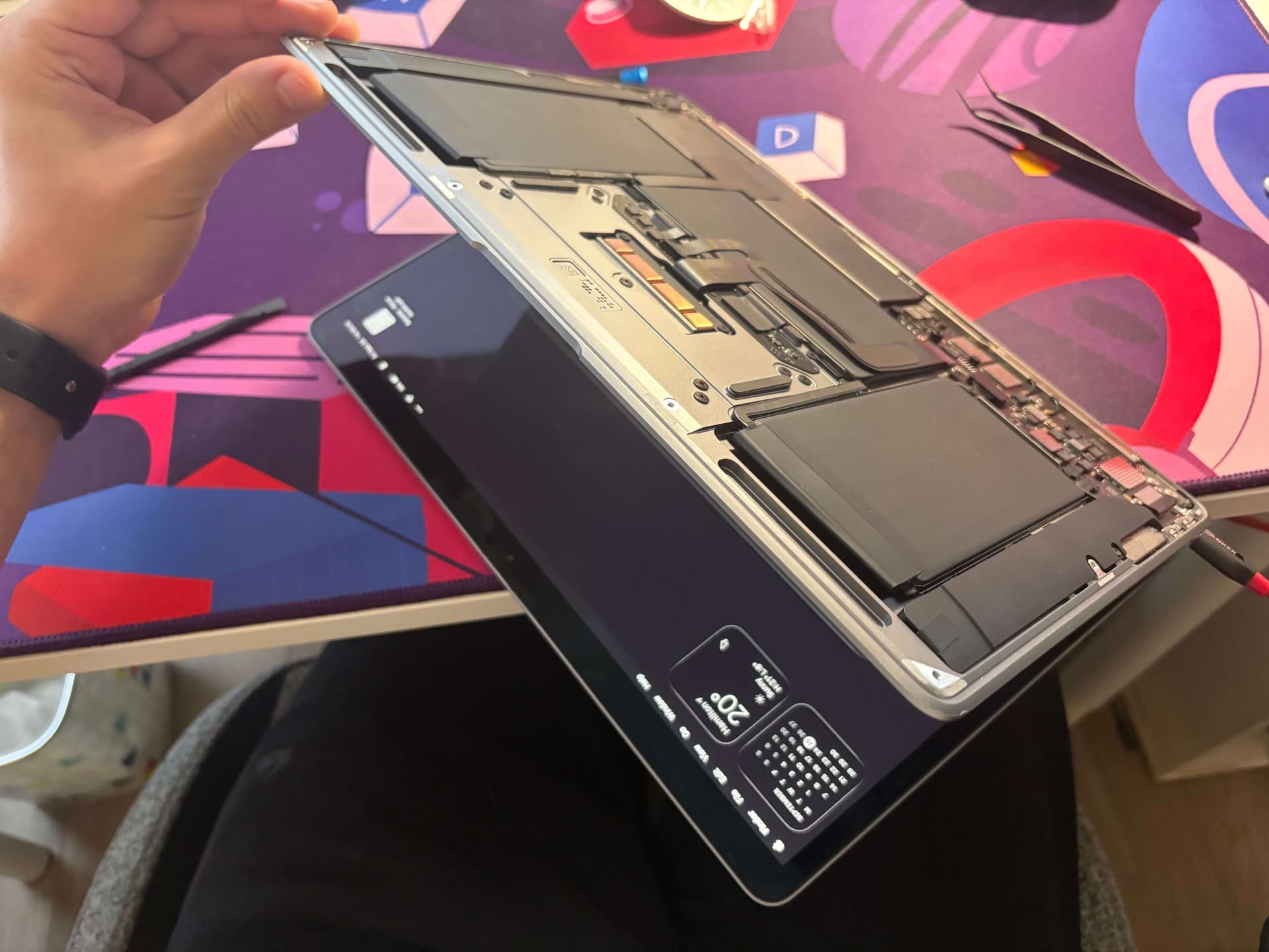 image of the macbook working with its bottom lid open